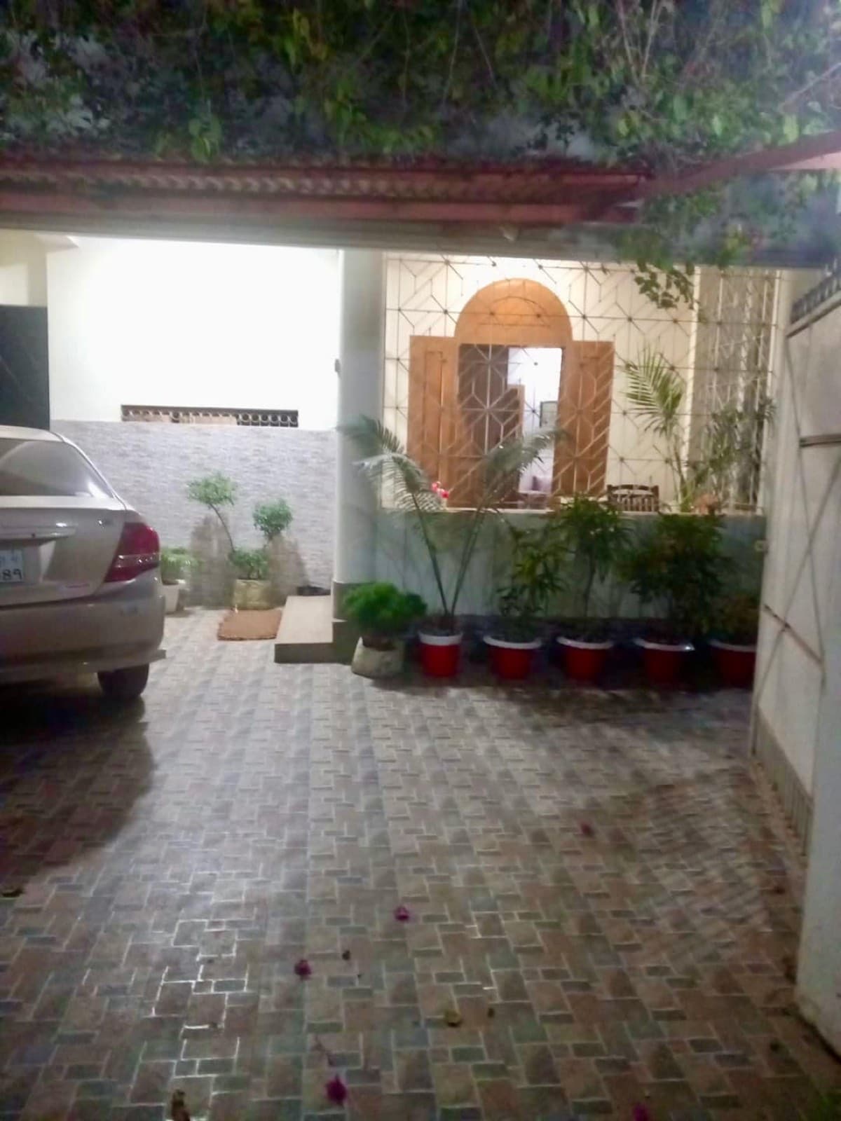 Covered driveway and porch entrance of the private room near Sreemangal railway station