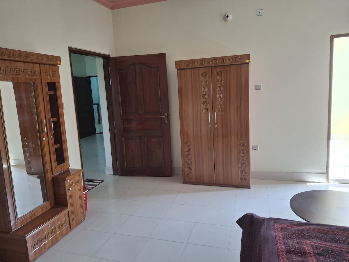 Bedroom wardrobe and dressing-mirror unit near the entrance door