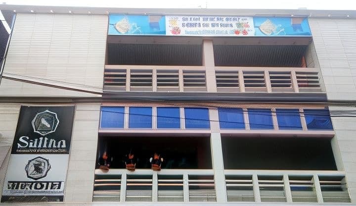 Sultan Restaurant & Guest House's multi-storey building front with its signage on Station Road