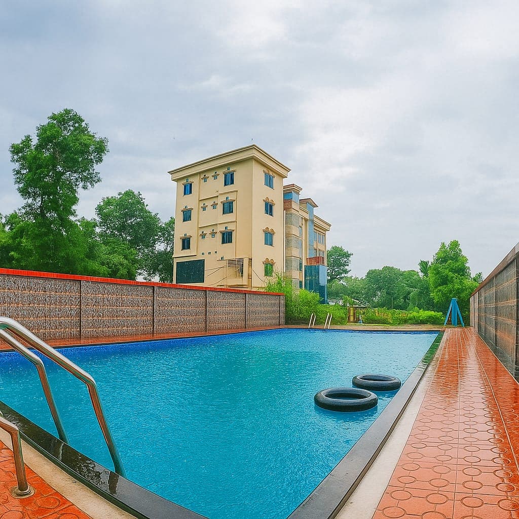 Grand Selim Resort & Tour's multi-storey building seen past the pool, with two floats in the water