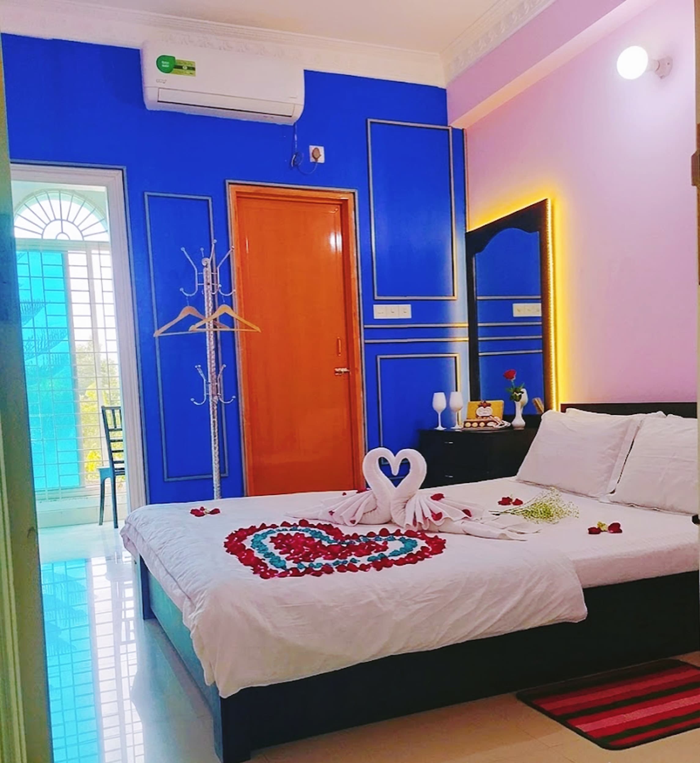 A Couple Deluxe room at Grand Selim Resort styled with a towel-swan display and rose petals on the bed