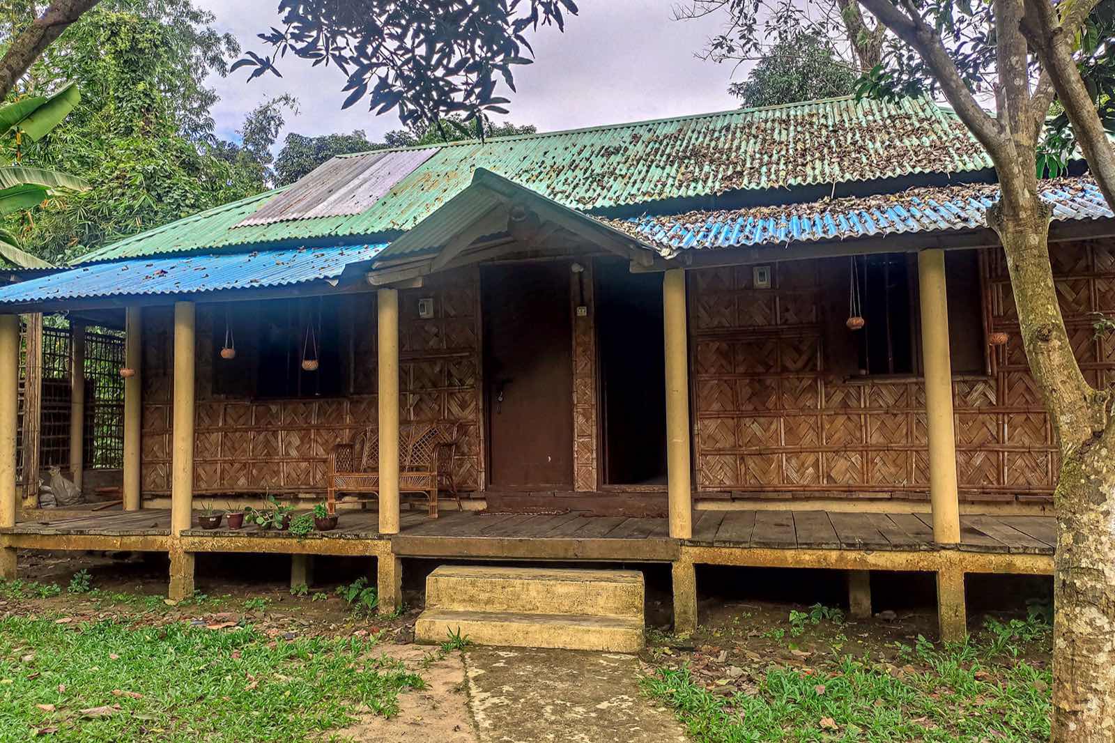 Shalik Cottage, a wooden cottage with a thatched roof at Nishorgo Eco Cottage